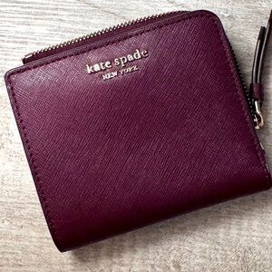 Kate Spade ♠️ New York wallet 
Color burgundy